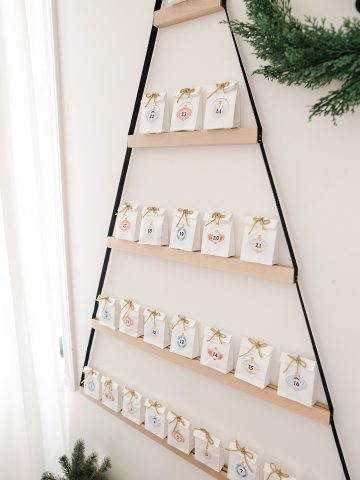 This holiday season, create an easy DIY advent calendar for kids! See how to make a unique day-by-day IKEA hack calendar with crystals inside.