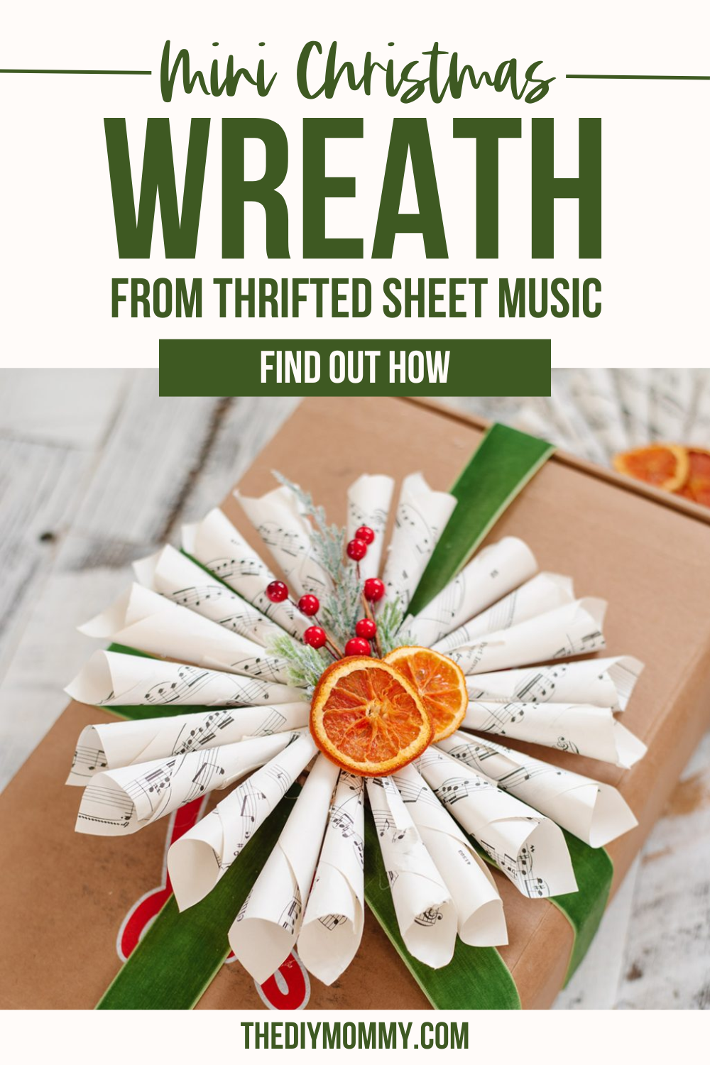 A mini wreath is made from sheet music and attached to a gift