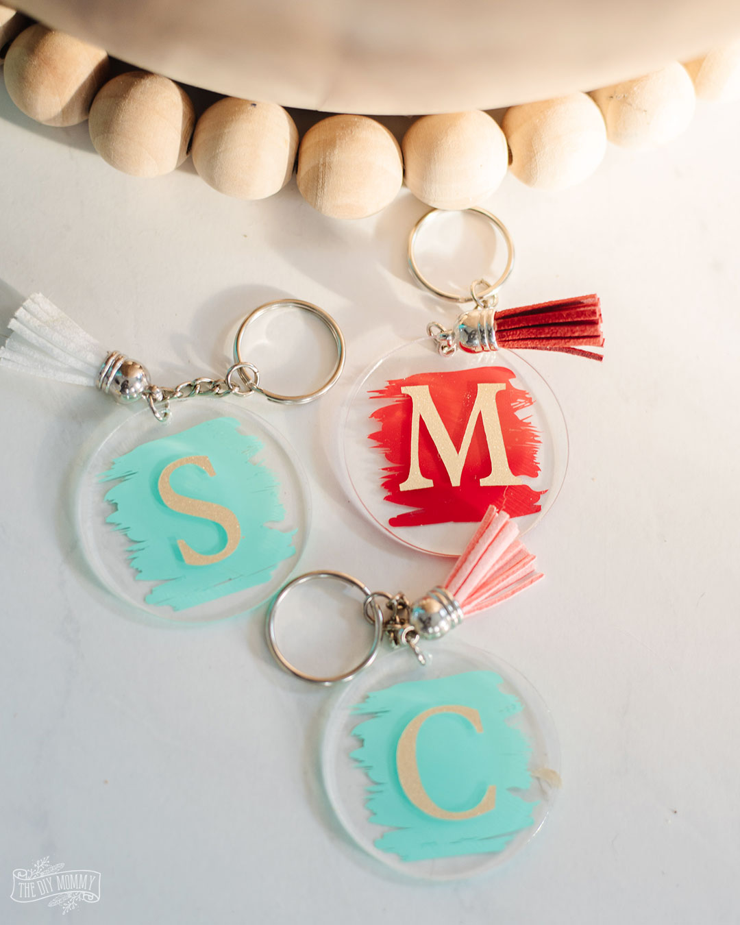 DIY Acrylic keychains in turquoise and red. Personalized gift are a great idea for any teacher on your list. 