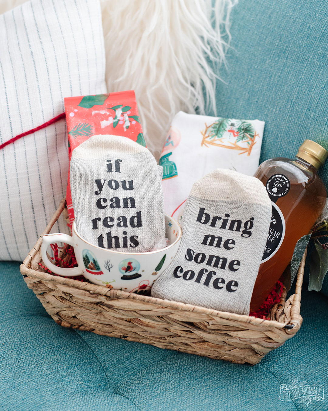 A wicker basket filled with personalized socks and other special gift items. A great DIY teacher Christmas gift idea.
