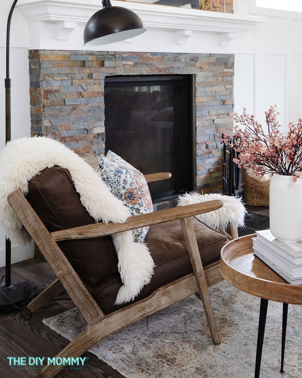 White sheepskin rug draped on brown chair in cozy living room.